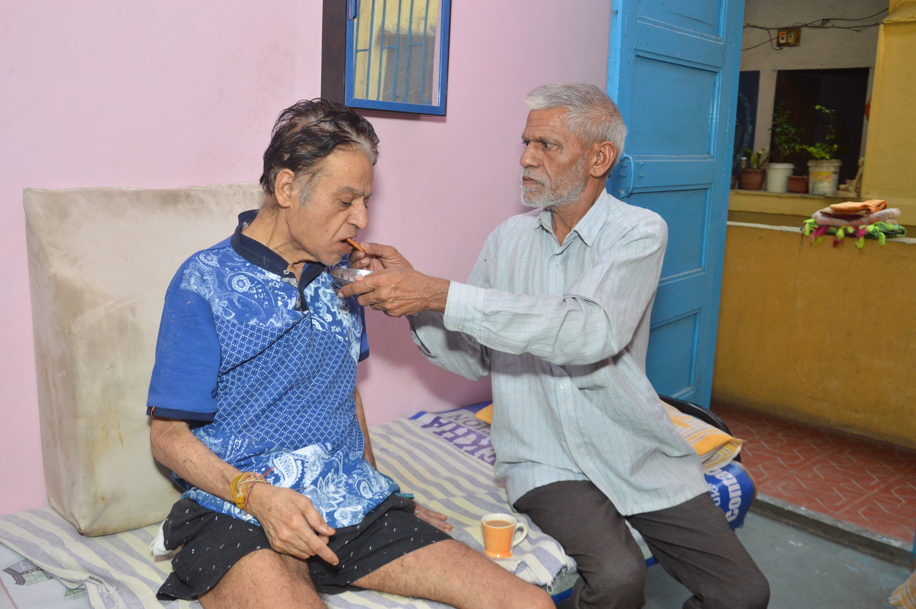 A doctor checking on an elderly person
